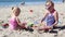 Girls Playing in the Sand at the Beach