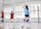 Girls playing volleyball indoor game