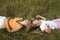 Girls plays on a meadow III