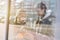 Girls pour tea from thermos behind glass wall