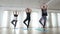 Girls practising balance in tree pose during a yoga class at the gym