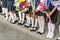 Girls primary school with bouquets of flowers in his hands. Shoes on her feet and white pantyhose, socks and stockings