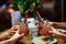 Girls in a restaurant clink glasses with a fresh summer cocktail. close-up of hands and glasses. Many Hands toasting with glasses.