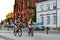 Girls ride bicycles in evening. Bialystok, Poland