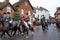 Girls riding horses fox hunting in rural Buckinghamshire town