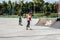 Girls rollerblading in the Park. Children have fun on roller skates. Spring entertainment