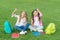 Girls school pupils doing homework together on fresh air, celebrate holiday concept