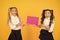 Girls school uniform hold poster. Visual communication concept. School friendship. School girls show poster. Social