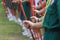 Girls scout line regulation closeup to hand holding pole