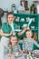 Girls, sisters, mother at table with Easter decoration. Celebration in kitchen.Tablescape for home Easter holiday.Family