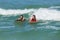 Girls Surfing Ocean Waves