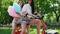 girls with sweet cotton in short shorts ride an electric scooter in the Park