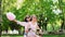 girls with sweet cotton in short shorts ride an electric scooter in the Park