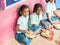 Girls teenagers pupils being served Meal plate of rice In government School Canteen. Unhealthy food for poor children