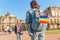 Girls travelers having fun in Dresden with rainbow flag symbol. Free love relationship concept