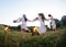 Girls in Ukrainian national shirts dancing around a campfire. Midsumer