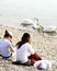 Girls watching swans on lake