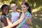 Girls wearing hula hoops around neck at campsite