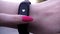 The girls wore a fitness bracelet. Girl checks pulse on fitness bracelet or activity tracker pedometer on wrist, sport