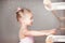 Girls - young ballerinas in pink dresses on a light background