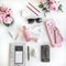 Girly flat lay with different accessories. Pink, rose, white, black.