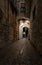 Girona, narrow cobblestone street at night, old Jewish Quarter, Spain