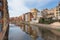 Girona riverside view with colorful houses along the Onyar river and Eiffel Bridge , Catalonia, Spain