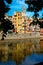 Girona`s skyline with famous Cathedral landmark and river houses reflected in the water