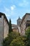 Girona, Spain, August 2018. Medieval architecture on a background of blue cloudy sky.