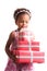 Give presents! Curly mulatto girl with gift boxes in hands on a white background