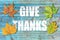 Give Thanks on blue wooden background