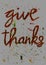 Give thanks. Inspiring words. Hand drawn using oil pastel.