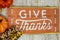 Give Thanks text phrase Thanksgiving holiday background