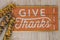 Give Thanks text phrase Thanksgiving holiday with Indian Corn