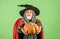 give it to you. gothic man in Halloween costume. senior man hold pumpkin. old man in magic hat and cloak. Jack-o-lantern