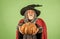 give it to you. gothic man in Halloween costume. senior man hold pumpkin. old man in magic hat and cloak. Jack-o-lantern