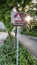 Give way to pedestrians sign board on road