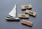 Give your full Attention symbol. Concept word Give your full Attention on wooden blocks. Beautiful grey background with boat.