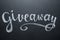 Giveaway retro card with handwritten chalk lettering. Template for social media.