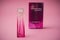 Givenchy irresistible  perfume  in pink bottle on pink background