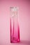 Givenchy irresistible perfume  in pink bottle on pink background