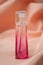 Givenchy irresistible perfume  in pink bottle on satin background