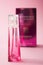 Givenchy irresistible  perfume  in pink miniature bottle on pink background