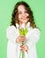 Giving gesture. Pure and innocent. Gift for mothers day concept. Little girl tulips flowers. Girl hold tulips bouquet