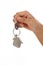 Giving house key with a key chain house shape