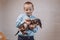 Giving puppy as gift. Kid, little boy getting surprised with dachshund puppy. Pet Lovers, Animal Lovers Gift. Getting a Puppy for