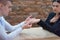 Giving of wedding ring. Man giving an engagement ring to his girlfriend. Man asking marry to his happy girlfriend