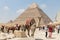 Giza, Egypt - April 19, 2019: Decorated Camel waits for a passenger in front of the Pyramid of Khafre, Egypt