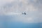 GIZYCKO, POLAND - AUGUST 5, 2018: Gyrocopter or autogyro in flight in the blue sky at Air Show Mazury 2018 event at the lake