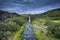 Gjain waterfall flowing in Pjorsardalur lush valley during summer at Iceland